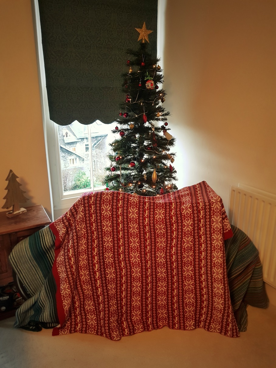 Bike wrapped in blankets Environmentally friendly way to wrap a kids bike at Christmas avoiding a plastic bike bag