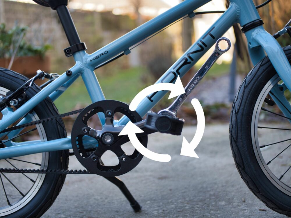 drive side tighten Photo showing the right hand pedal being put back onto a kids bike and arrow showing which is the correct way to tighten the pedal