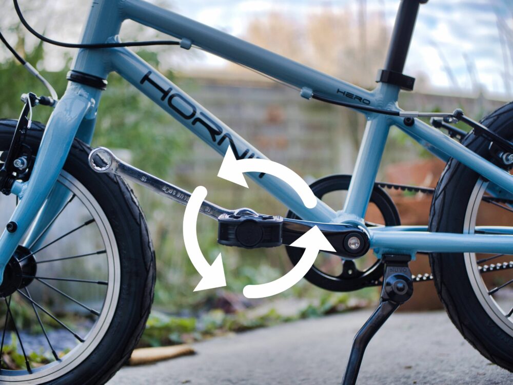 no ndrive tighted Photo of bike having pedal being put back on the non drive side showing which way to turn them with arrow showing direction of travel of spanner
