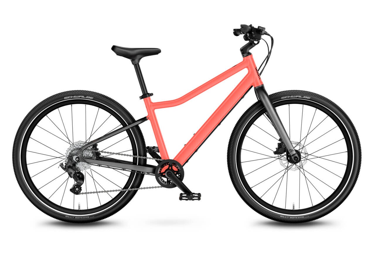 Best 24" kids bikes: A side view of the woom Explore 5 kids' bike on a blank background