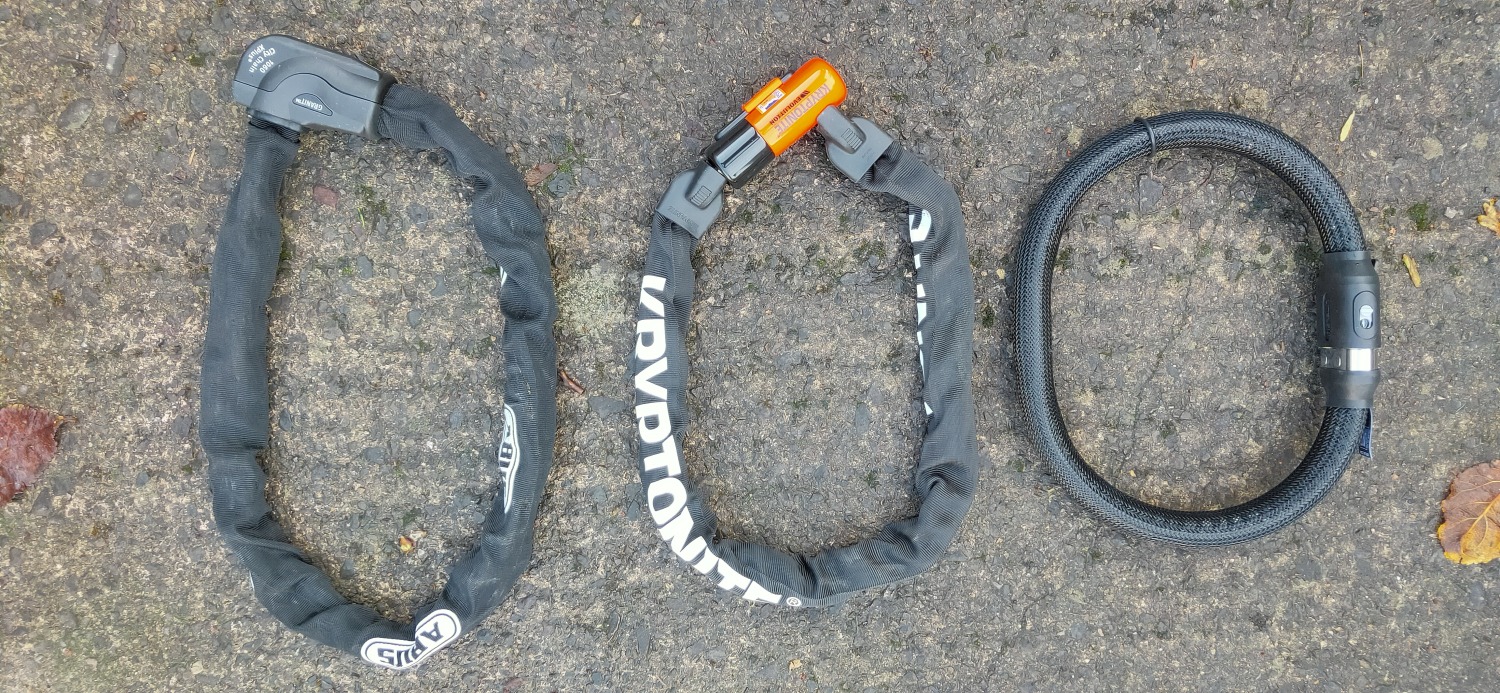 Three bike locks Two chain locks and the Litelok Core Plus bike lock side by side