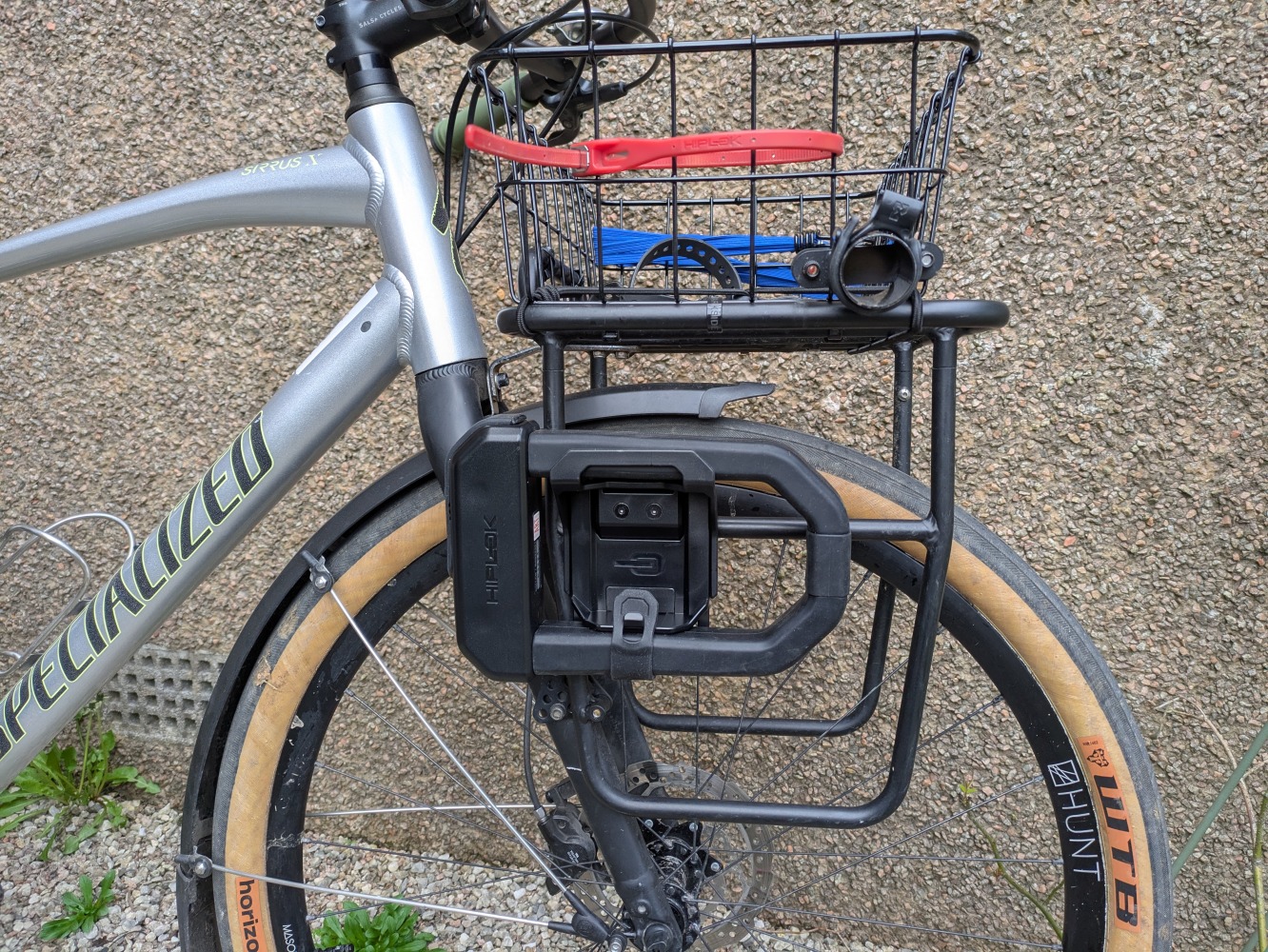 A black hiplok D1000 mounted on the front of a silver bike
