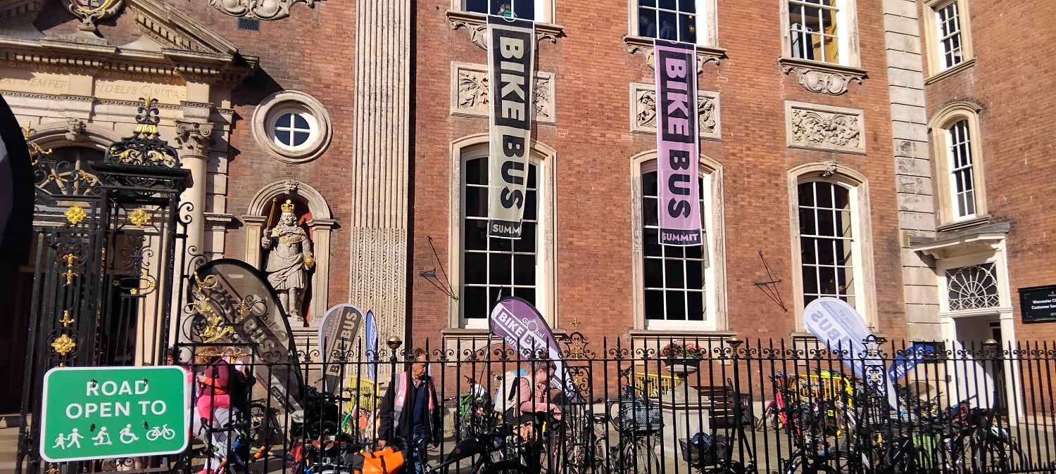 Guildhall in Worcester with Bike Bus Summit flags and bicycles parked up