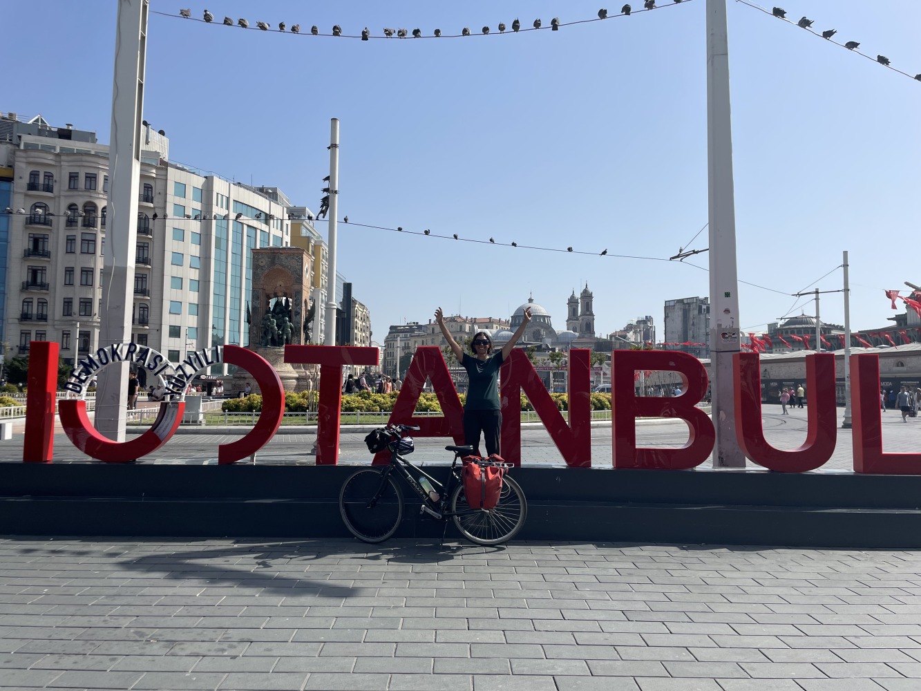 Sahir's cycle touring photos: Sahir posing in front of an art installation that spells ISTANBUL