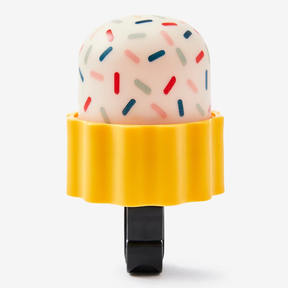 Best bike accessories for kids: A bike bell that looks like a cake, with sprinkles on top