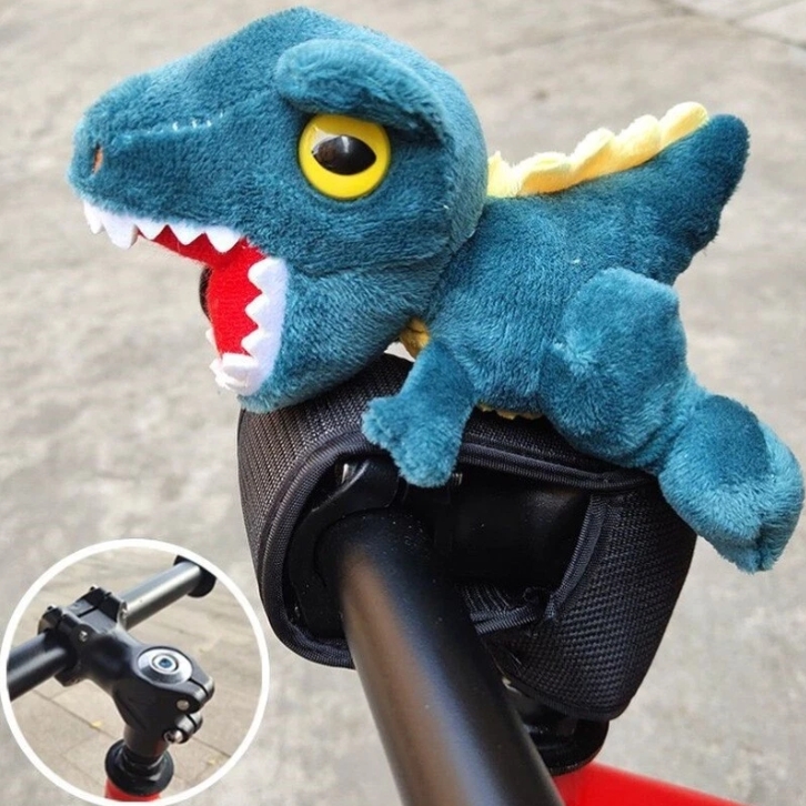 Best bike accessories for kids: A dinosaur plushie affixed to a handlebar