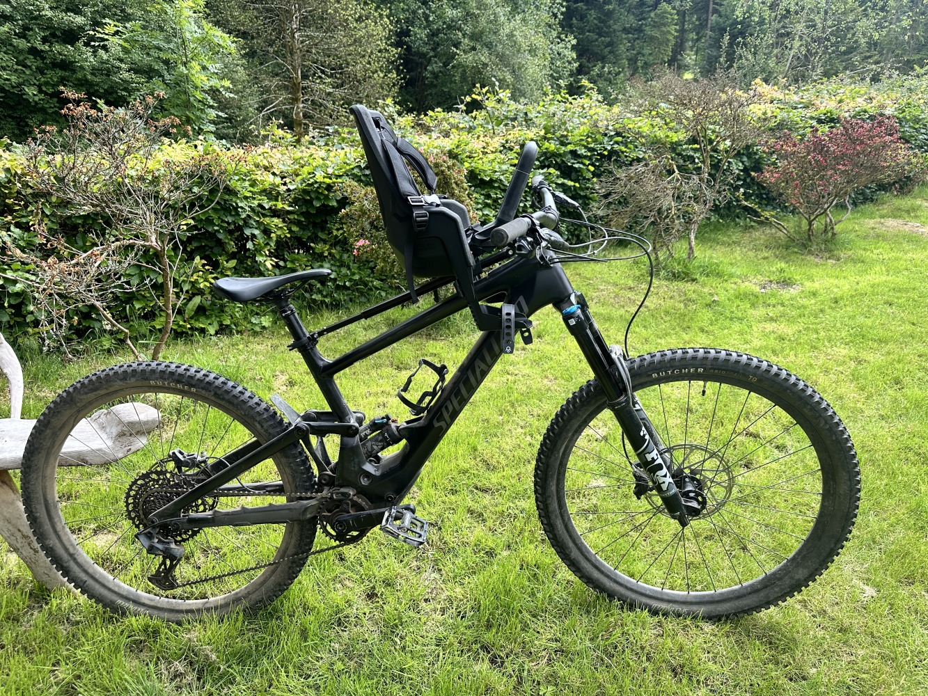 a photo of the kids ride shotgun pro evo baby seat mounted to a mountain bike