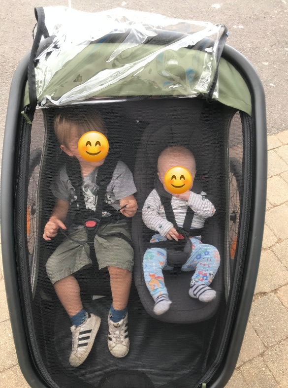 A family review of the hamax outback double trailer- two boys sat in the trailer
