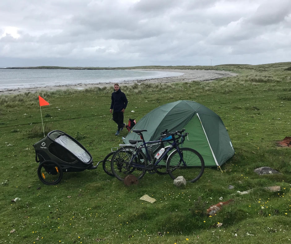 a family wild camping with their bikes and the Hamax Outback trailer