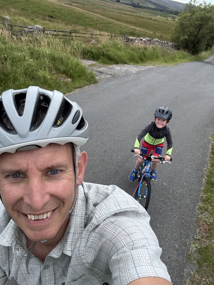 selfie of a dad and daughter riding with the Zefal Bike Taxi tow rope review