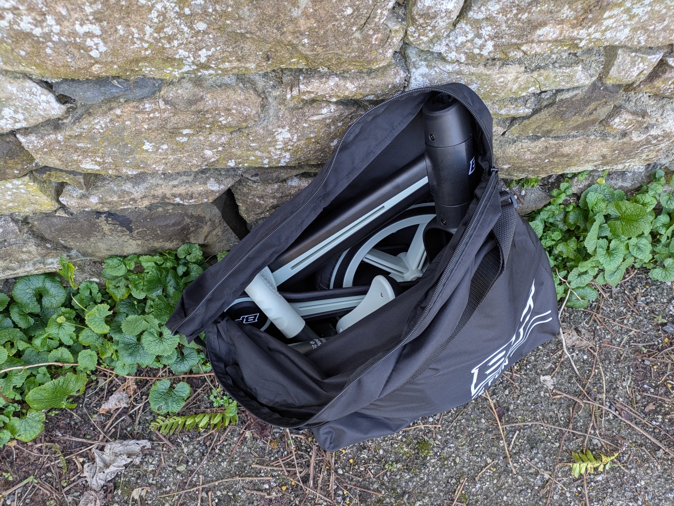 Be Fun wheels folding balance bike, folded in its case