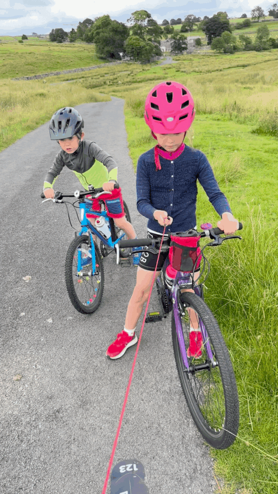 gif video of a girl in a pink helmet letting go of the tow rope and it retracting