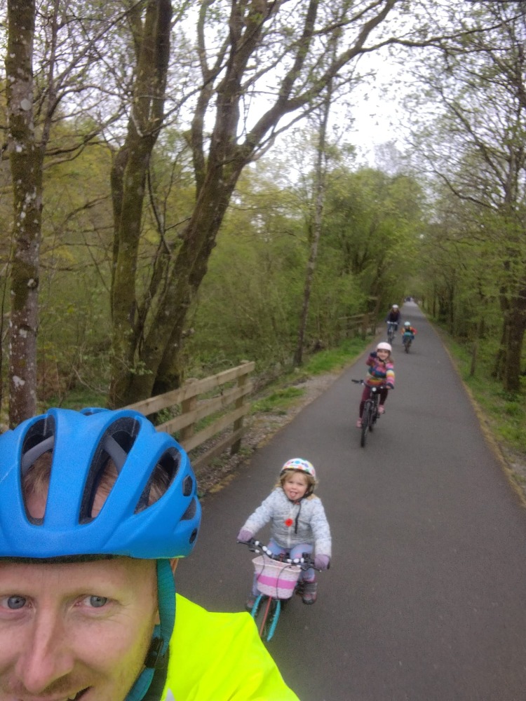 selfie of a dad and daughter riding with the Zefal Bike Taxi tow rope review