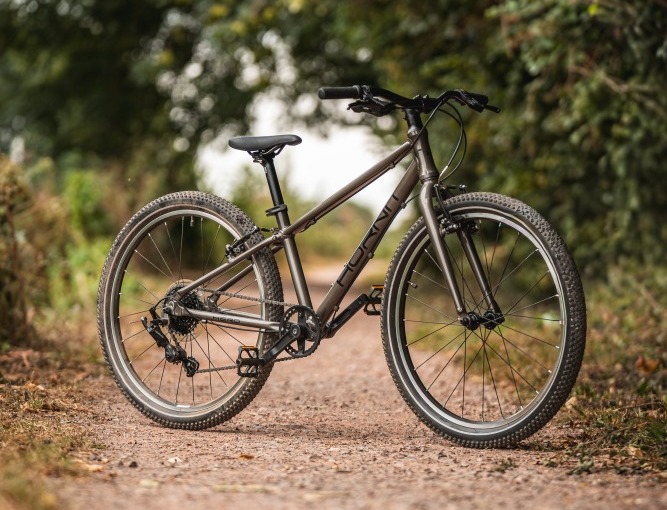 The Hornit HERO 24 standing alone on a gravel path with trees in the background