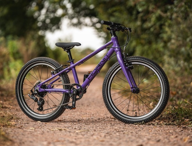 The Hornit HERO 20 standing alone on a gravel path with trees in the background