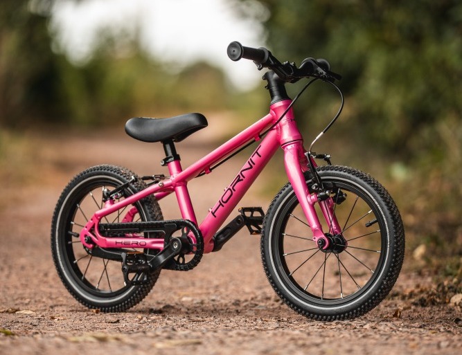 The Hornit HERO 14 standing alone on a gravel path with trees in the background