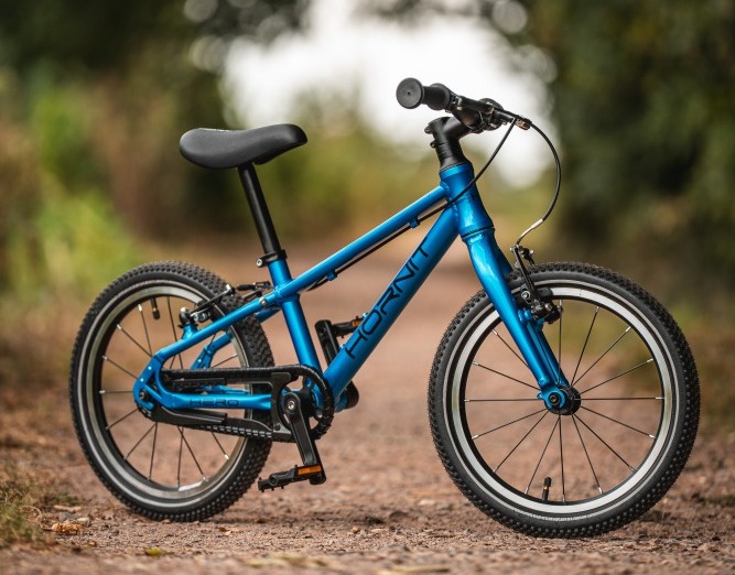 The Hornit HERO 16 standing alone on a gravel path with trees in the background