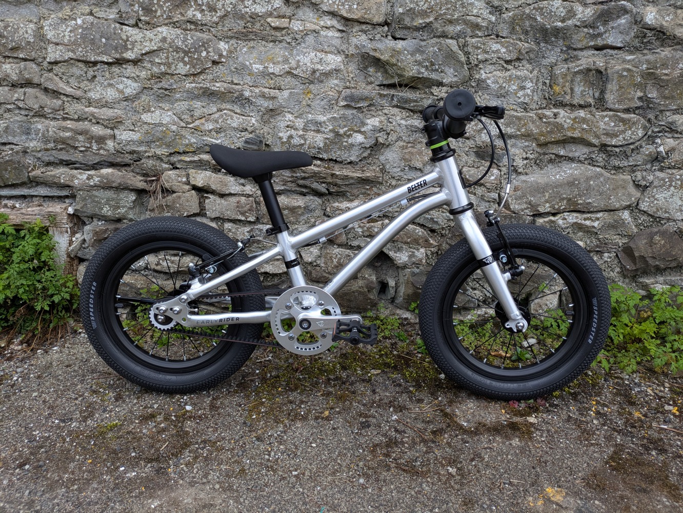 A photo of the silver Early Rider Belter 14 leaning against a wall