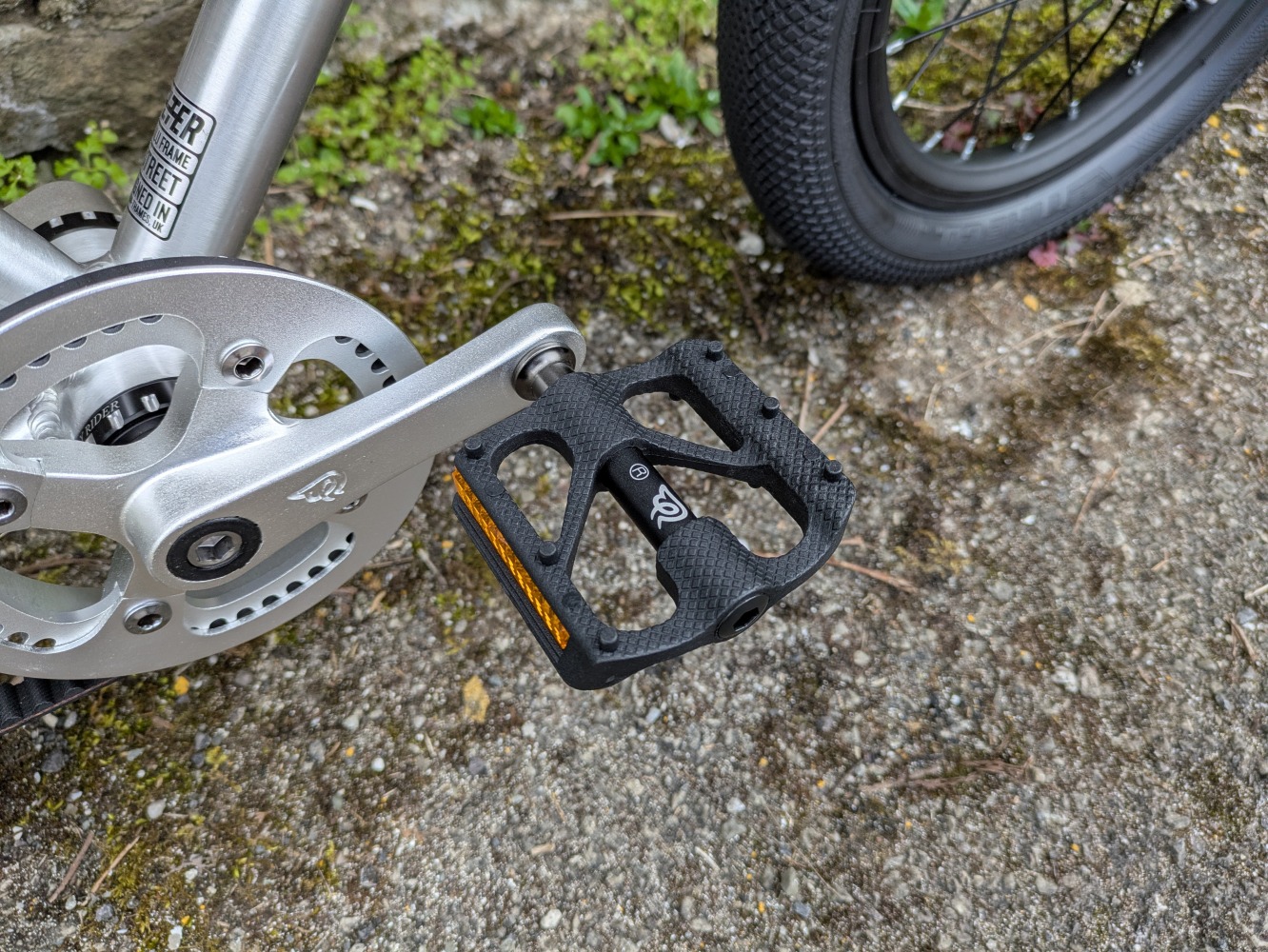 A close up of the predal on the silver, early rider belter- cycle sprog rider review