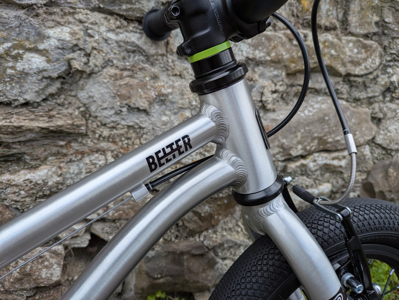 A close up of the logo on the silver, early rider belter 14 bike - cycle sprog rider review