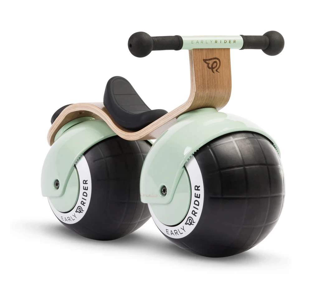 A pistachio coloured Bella Velio- a baby balance bike